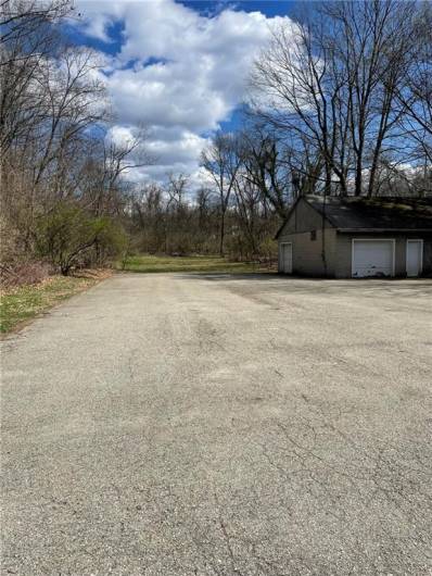 Parking lot for 30 plus vehicles.   Two car detached garage currently used for storage