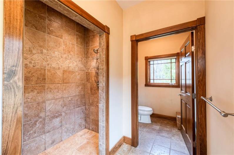 Full ceramic walk-in primary shower.