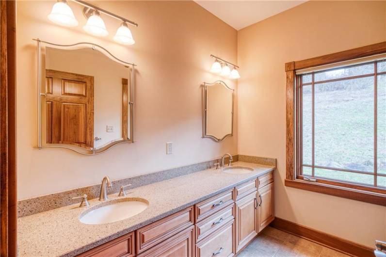 Hall bath with dual vanities.