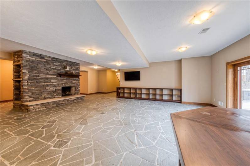 AMAZING slate flooring and notice the awesome fireplace.