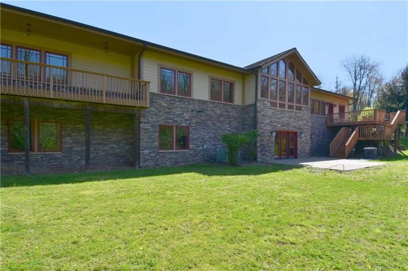 Deck on left is directly accessible from master bedroom.  Please notice the large patio!