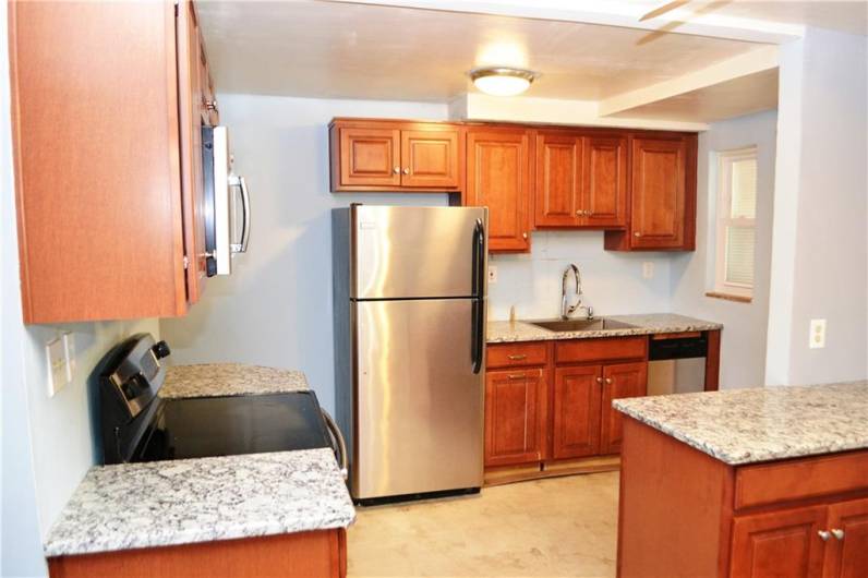 Kitchen with stainless steel appliances.