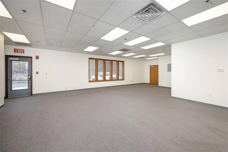 Main Room with foyer entry door on upper right