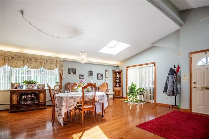 The kitchen opens up to the dining room. Sliding doors open to the covered patio for easy entertaining. This large space could also be used as a family room for open concept living.