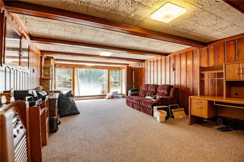 An over-sized downstairs family room that over looks the back of the house. Just imaging sliding glass doors here for Al-fresco dining!