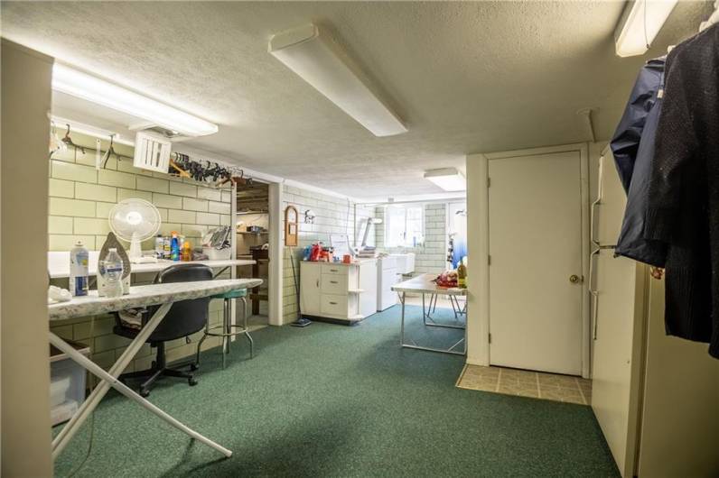 Everyone's dream laundry room! It's massive and has outdoor access. Not to mention super cute!!