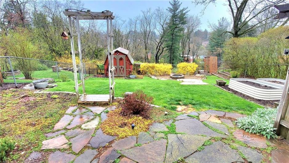 Backyard and garden space, paving stones, trellis, & storage shed