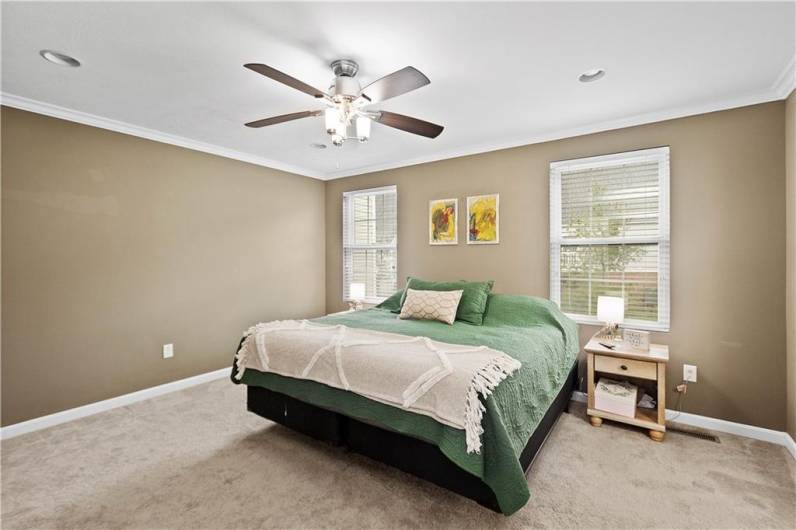 Large master suite with crown molding.