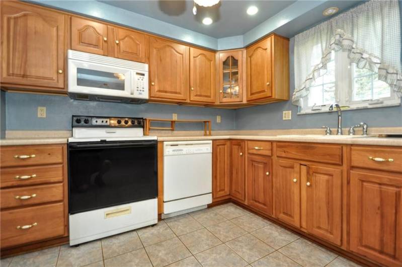 The spacious kitchen with Hickory cabinets