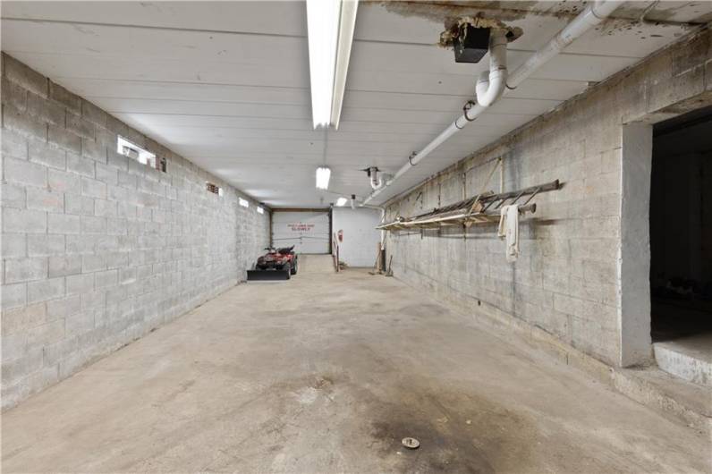 Interior view of garage access.  This space has been used in the past as classic car storage.