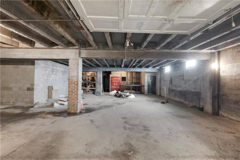 Basement area with underside view of the reinforced floors and beams.