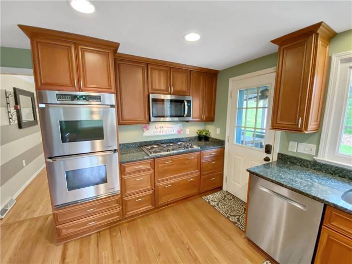 The kitchen features high-end stainless steel appliances, including the Dacor double oven.