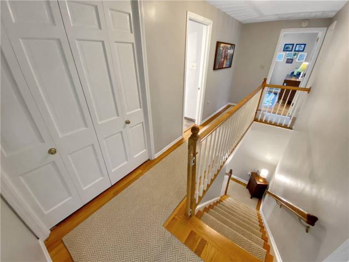 The second floor hallway has a double closet for storage of linens, towels, and more!