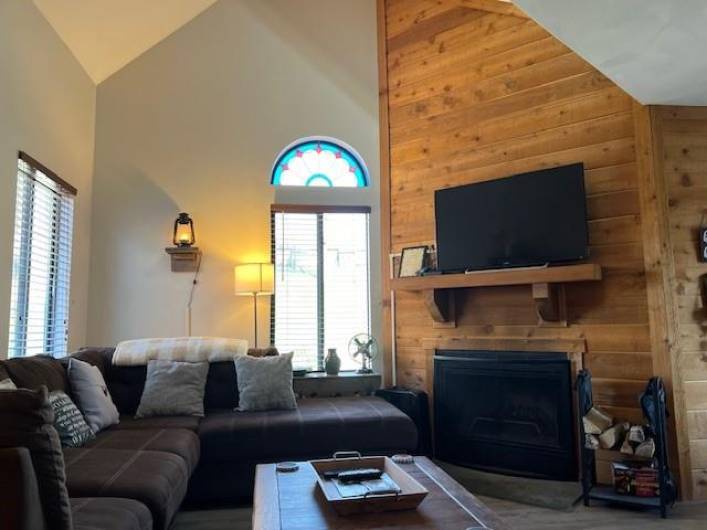 COZY LIVINGROOM WITH VAULTED CEILING AND WOODBURNING FIREPLACE--GREAT FOR ENTERTAINING