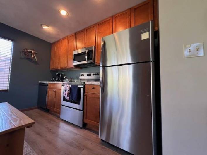 UPDATED KITCHEN CABINETRY, STAINLESS APPLIANCES AND FLOORING