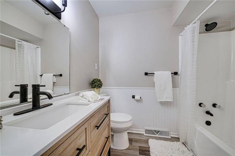 Completely updated main level guest bath with all the modern touches.