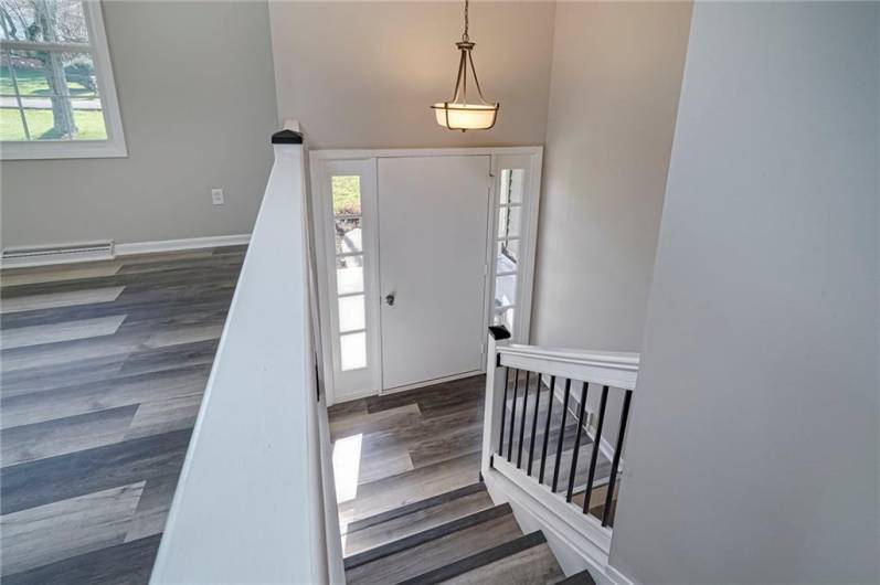 Custom railing, new floors, paint and fixtures for the modern buyer.