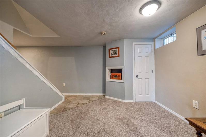 Finished lower-level with walk-out door to private patio and treelined backyard.