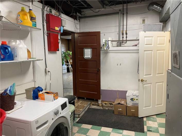 Interior View of the Laundry Room & portion of Former Beauty Salon Space on lower level