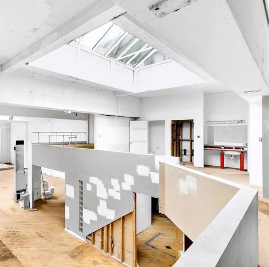 LOOKING DOWN TO THE WIDE OPEN LIVING SPACE FROM THE LOFT AREA...