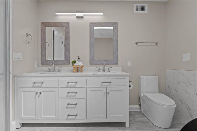 Full Bathroom #1 of 4. Completely updated with one-piece Lav, dual vanity, new lighting, plumbing, floors