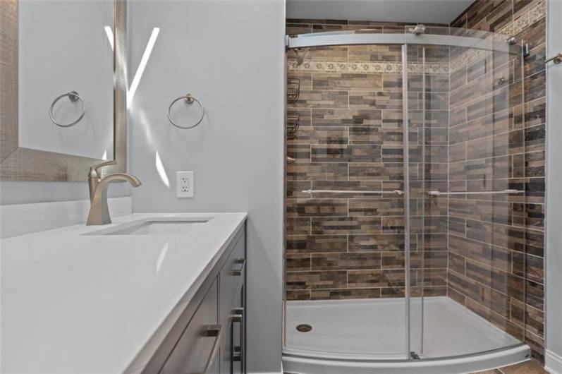 Full Bathroom #2 of 4. New Elements include Frameless Sliding Doors to Ceramic Tile Shower