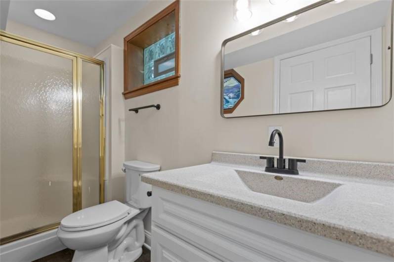 Full Bathroom #4 of 4 - Located on the Lower Level. New Elements Include vanity, lighting and plumbing