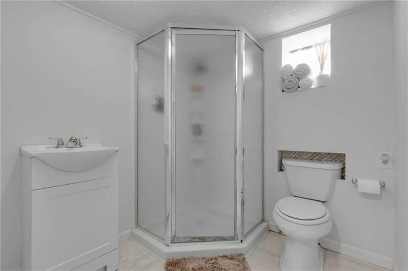 Full bathroom with Shower in Basement.