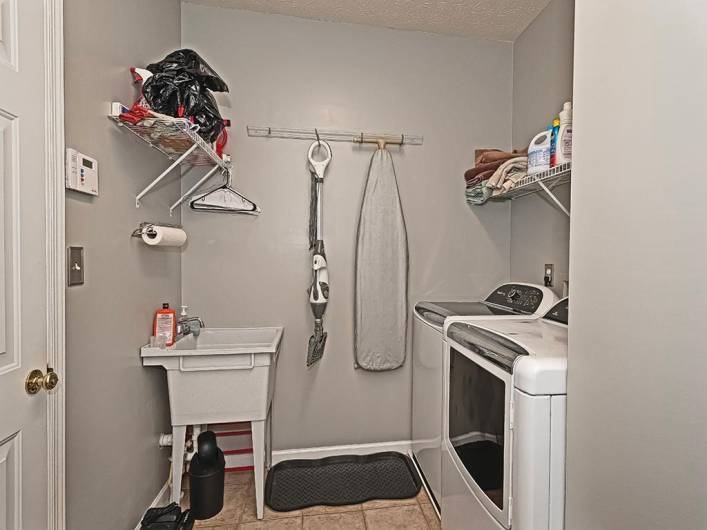 Laundry room is located on the first floor right off the garage.