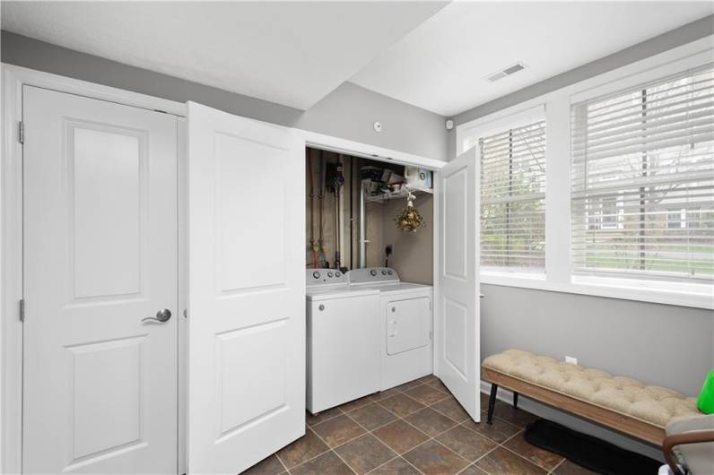 Right off the garage there is closet & laundry with plenty of room for a mudroom bench!