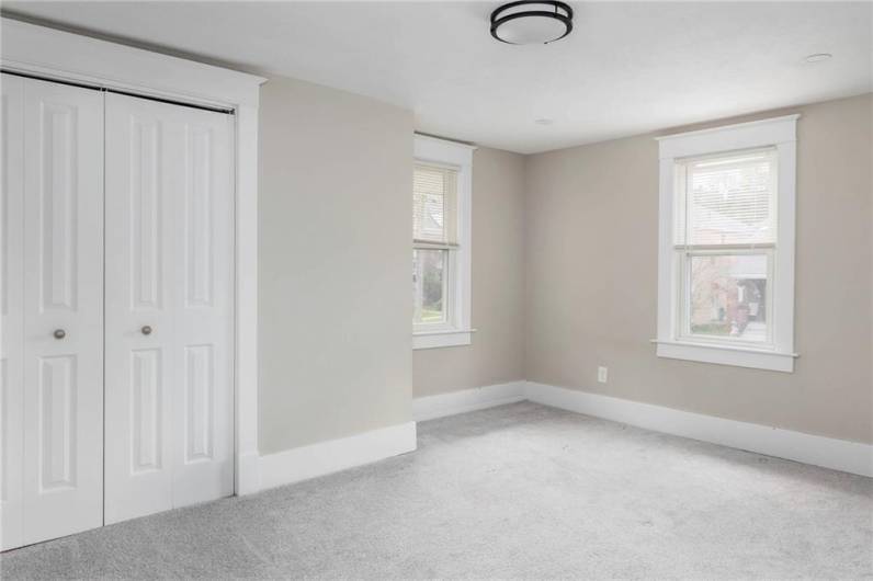 The first of the three spacious bedrooms provides a large closet storage.