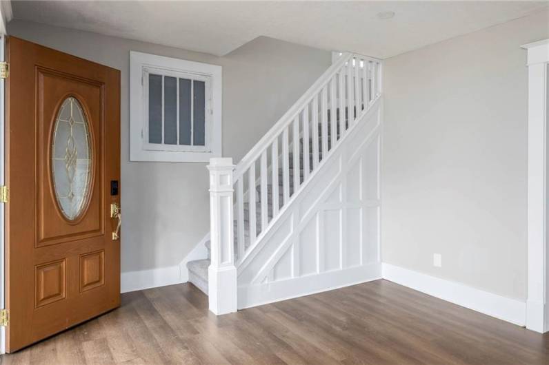 Walk inside and appreciate this beautifully updated home featuring neutral decor, newer vinyl plank flooring on the main level and carpeting leading to and throughout the upper level.