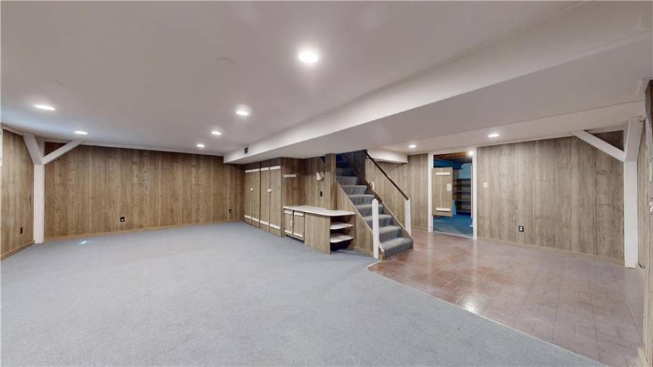 The spacious lower level game room adds a generous extension of living space to this large home.