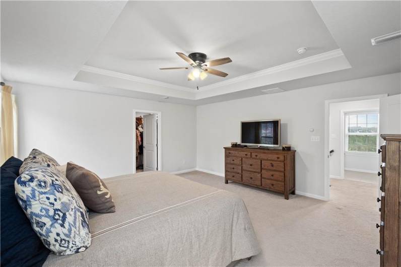 Tray ceiling with crown molding highlights this exceptional space!