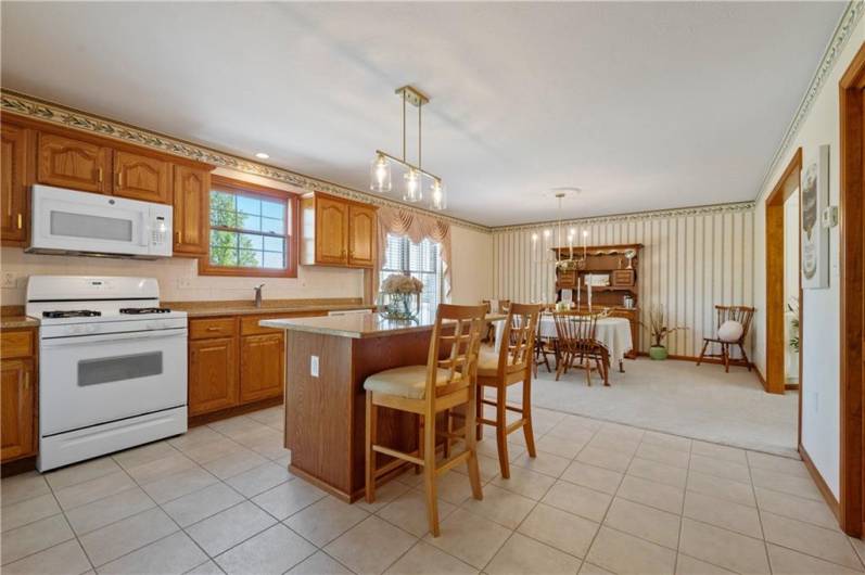 The kitchen includes pristine tiled floors.