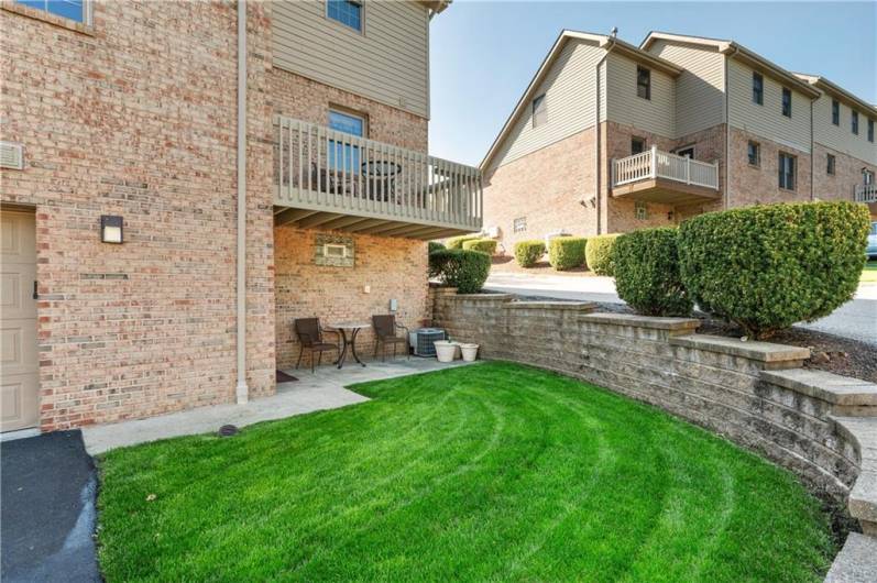 The home offers a great outdoor space with a deck, patio and green space.