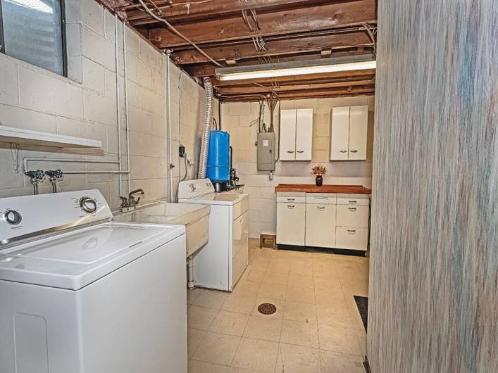 Clean and Tidy Laundry Room - with Double Washtub, Storage, and a Folding Counter w/Cabinet.