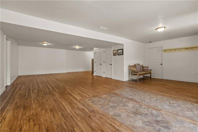 The lower level features a large rec room, bathroom, storage closets an additional bonus room and a workshop.
