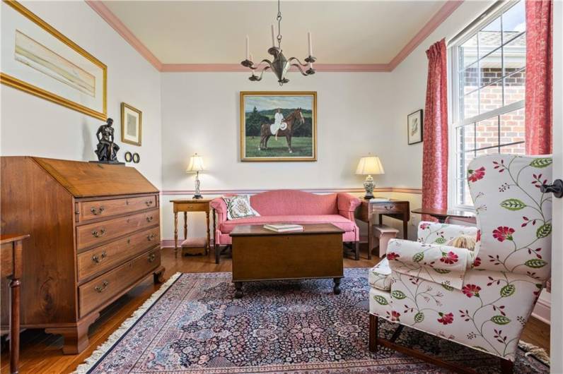 Located off the entry is an office currently used as a sitting room.