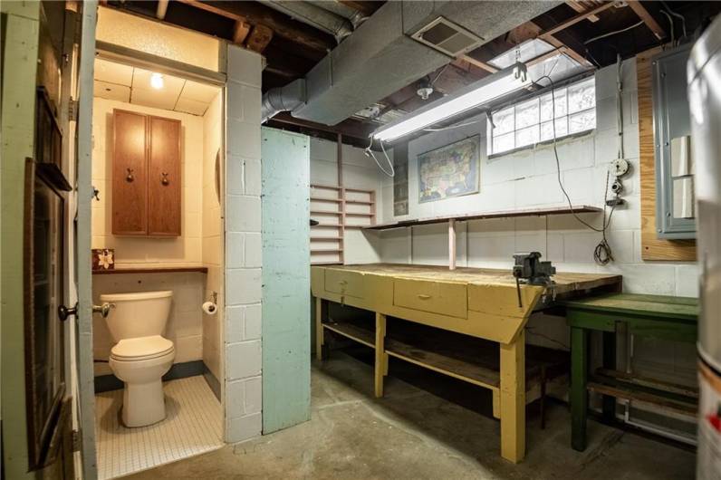 basement offers a workbench and an additional bathroom.
