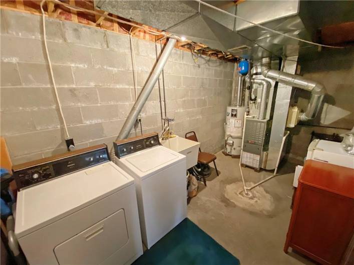 One car integral garage plus this laundry/utility room with extra storage.