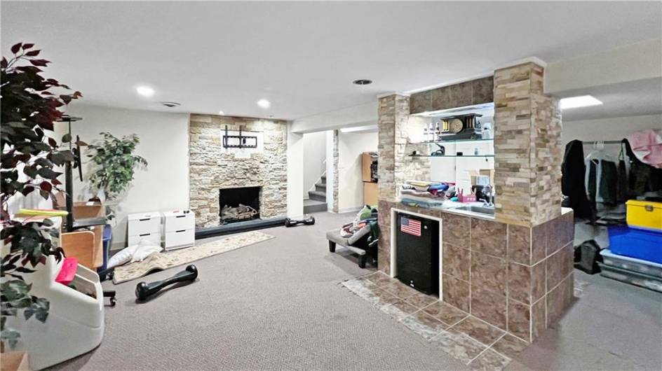 Come on downstairs and enjoy the bar, the gas fireplace and room for fun and games!