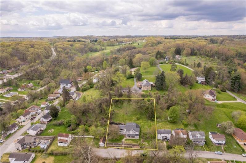Located at the end of a cul-de-sac and situated on a double lot! The vacant lot to the right of the house is included. Outline shows approximate lot lines of the 2 lots.
