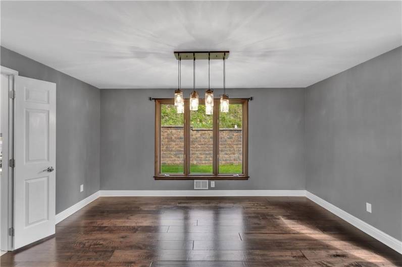 14Room w/Gorgeous Lighting and Continued Engineered Hardwood Flooring. Double Doors to the Kitchen can be Closed as well.x12, Open to Kitchen and Living