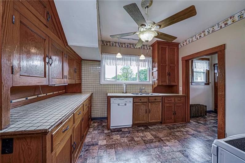 Kitchen with original custom & deep cabinetry