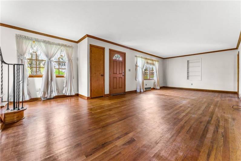The main living/dining room combination has hardwood floors, and a picture windows for lots of light