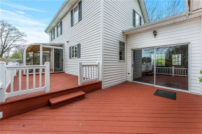 deck with entry from the breezeway and sunroom