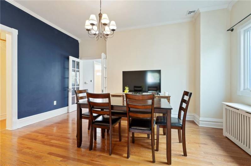 Dining room has accent wall and is a good centerpiece of the home for entertaining.