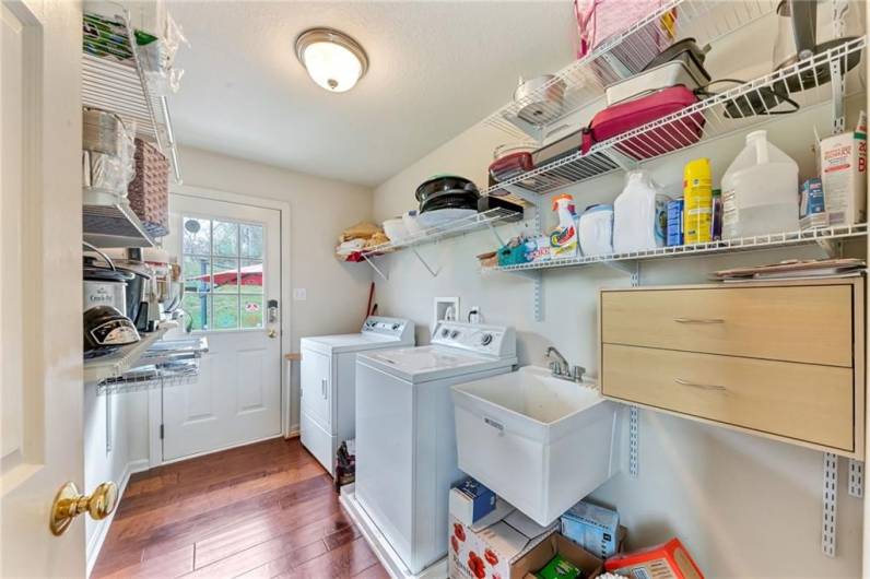 Convenient first floor laundry is located right off the kitchen.  There is a door leading to the back yard.