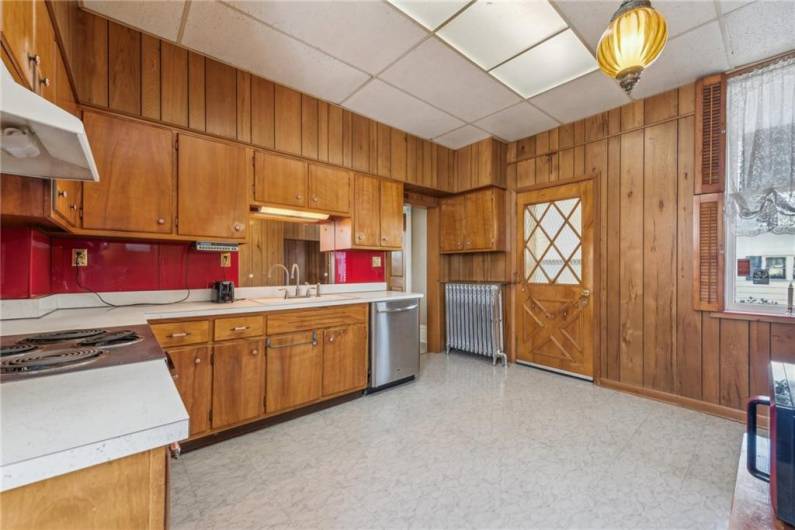 This kitchen hosts many opportunities to become one of your dreams, with it's own private access from the small covered porch around back, which makes carrying in groceries easy as pie.